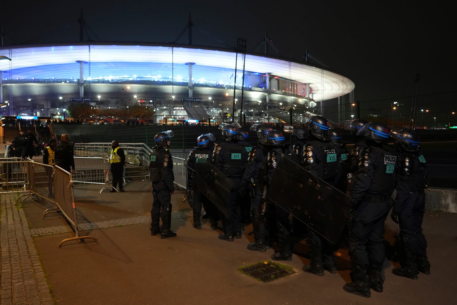 Police officers take position ahead of the Nations League soccer match France against Israel outside the Stade de France stadium, Thursday, Nov. 14, 2024 in Saint-Denis, outside Paris. (AP Photo/Aurelien Morissard)