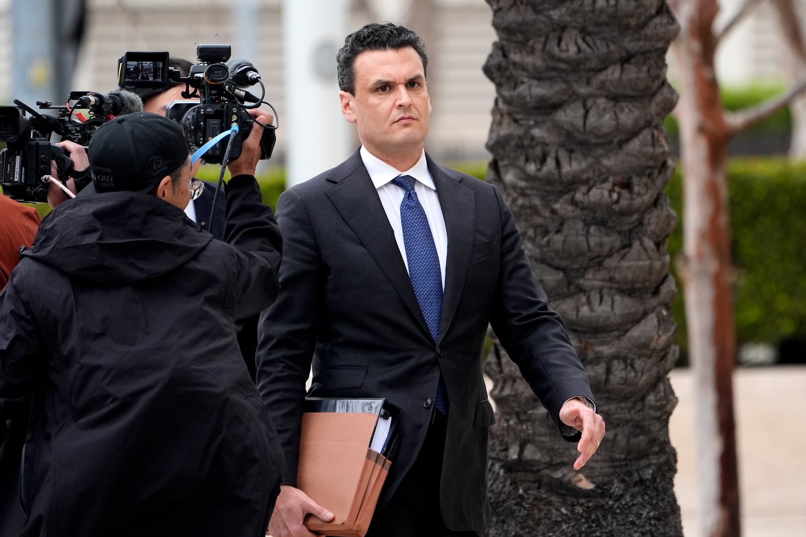 Michael G. Freedman, attorney for Ippei Mizuhara, former interpreter for Los Angeles Dodgers baseball star Shohei Ohtani arrives at federal court for Mizuhara's sentencing on bank and tax fraud on Thursday, Feb. 6, 2025, in Santa Ana, Calif. (AP Photo/Damian Dovarganes)