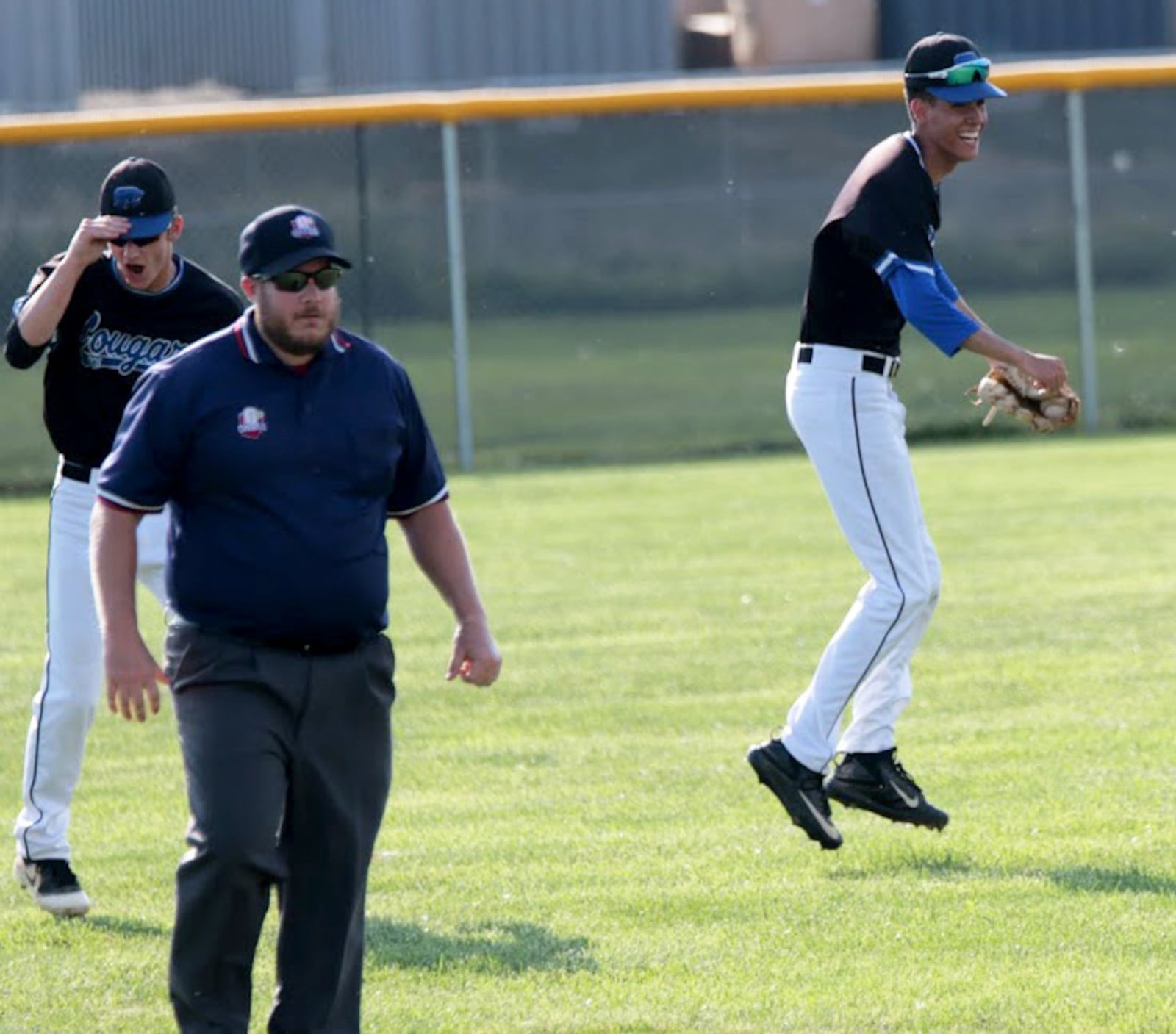 Cincinnati Christian’s Winston Spencer (right) reacts after catching the last out May 24 in a 3-1 win over Tri-County North in a Division IV district baseball final at Carlisle’s Sam Franks Field. RICK CASSANO/STAFF