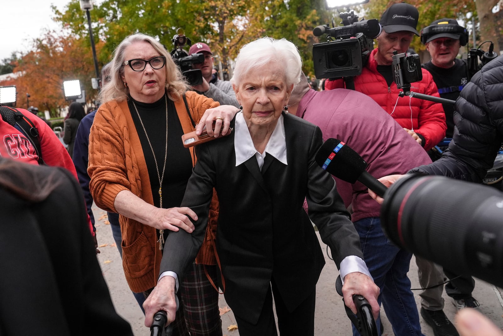 Erik and Lyle Menendez's aunt Joan VanderMolen, center, arrives at a courthouse to attend a hearing in Los Angeles, Monday, Nov. 25, 2024. (AP Photo/Jae C. Hong)