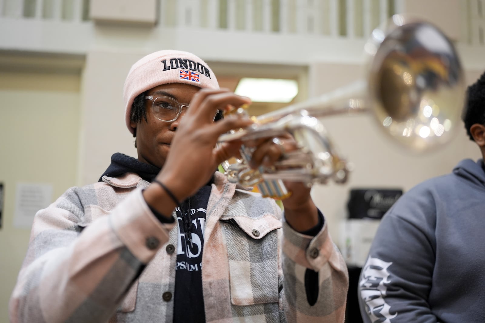 Brandon Wooten plays the trumpet during rehearsal at the Stax Music Academy, Thursday, Jan. 30, 2025, in Memphis, Tenn. (AP Photo/George Walker IV)