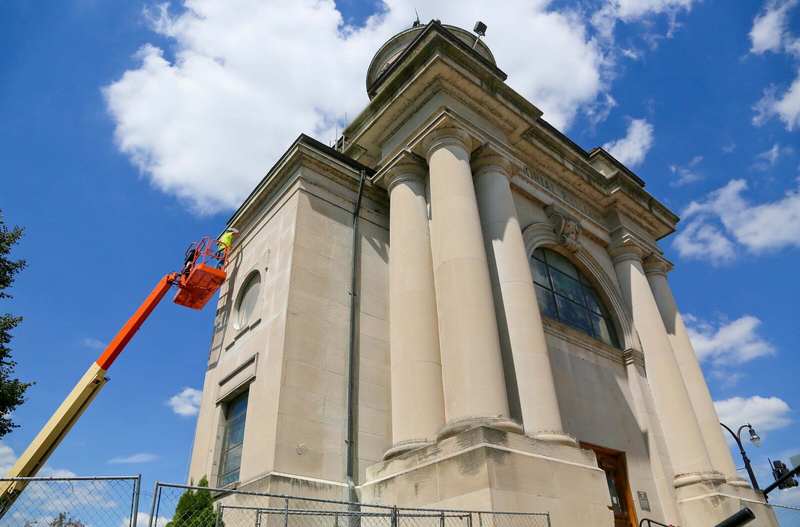 Bob Snow of Lee Restoration works on the Soldiers, Sailors, and Pioneers monument last August in downtown Hamilton. 