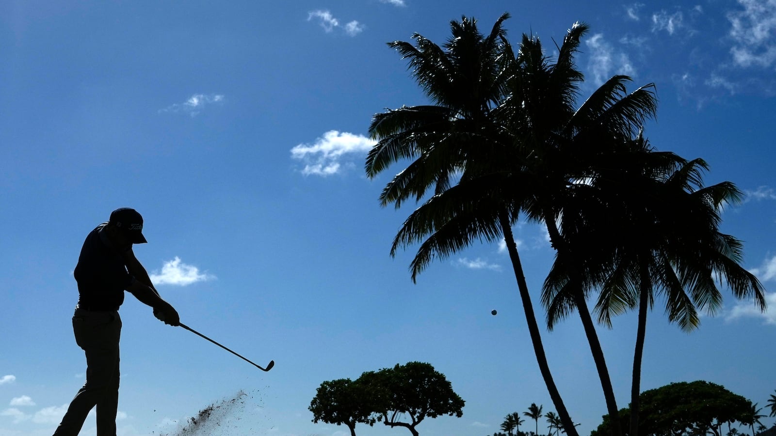 Lee Hodges hits a fairway shot on the 17th hole during the third round of the Sony Open golf tournament, Saturday, Jan. 11, 2025, at Waialae Country Club in Honolulu. (AP Photo/Matt York)