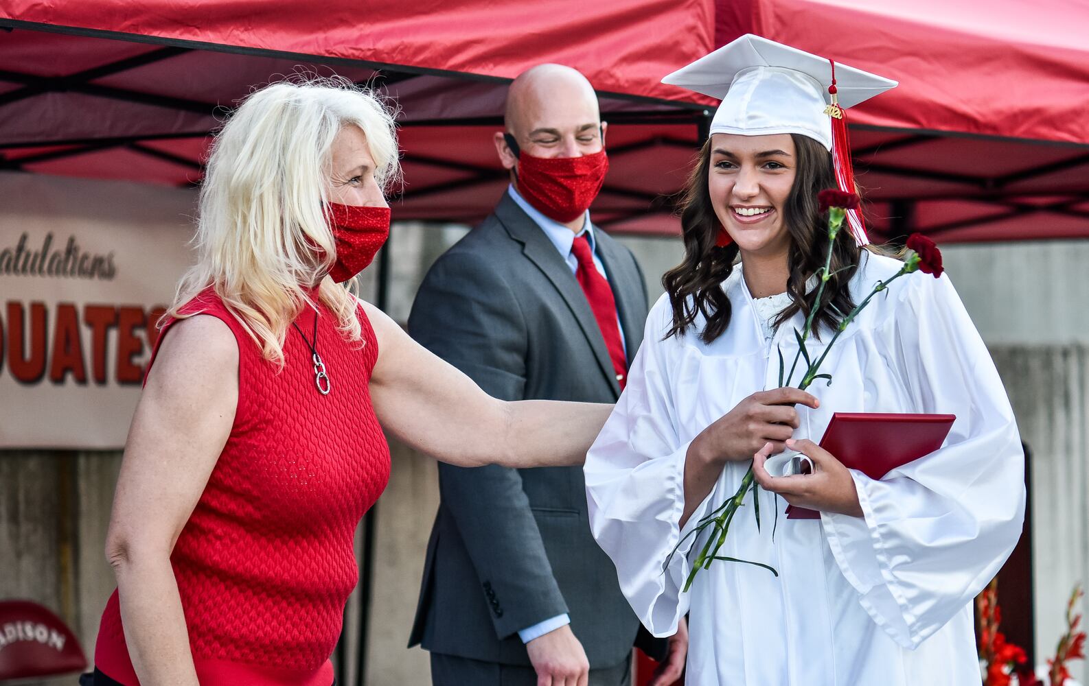 Madison High School drive-thru graduation ceremony at Land of Illusion