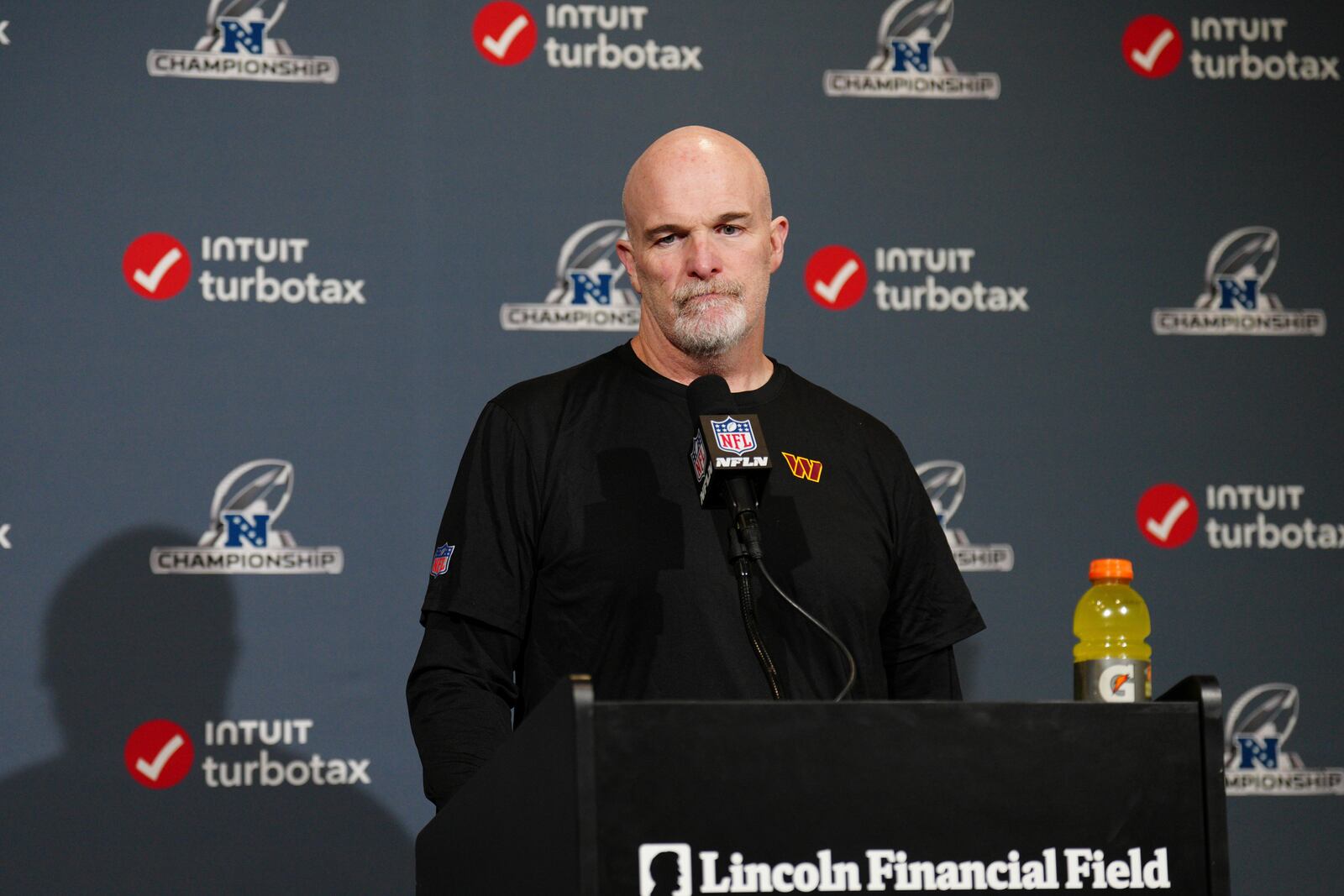 Washington Commanders coach Dan Quinn listens to a question during a news conference after the NFC Championship NFL football game against the Philadelphia Eagles, Sunday, Jan. 26, 2025, in Philadelphia. (AP Photo/Derik Hamilton)