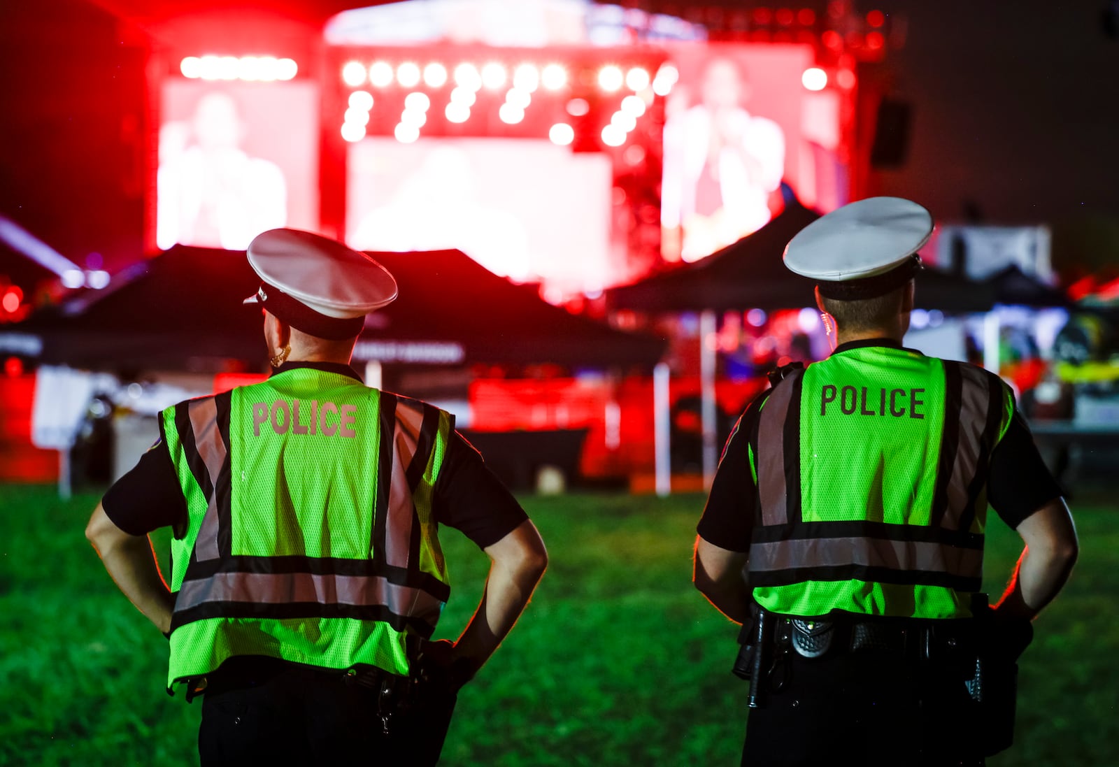 Police provide security as thousands of fans gather on day three of the first Voices of America Country Music Fest Saturday, Aug. 12, 2023 on the grounds of National Voice of America Museum of Broadcasting in West Chester Township. NICK GRAHAM/STAFF