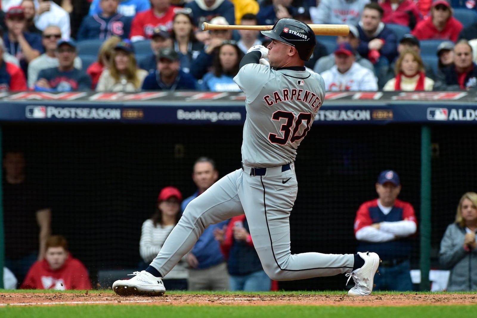 Detroit Tigers' Kerry Carpenter loses his bat on a swing in the sixth inning during Game 5 of baseball's American League Division Series against the Cleveland Guardians, Saturday, Oct. 12, 2024, in Cleveland. (AP Photo/Phil Long)