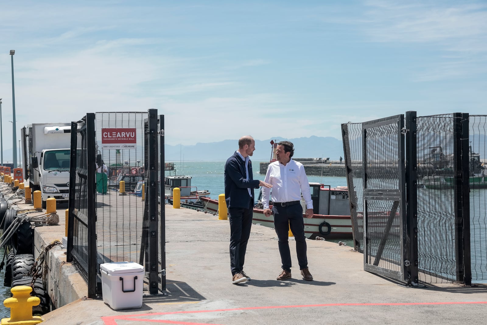 Britain's Prince William, the Prince of Wales, speaks to Co-owner of ABALOBI Serge Raemaeker, who were 2023 Earthshot finalists, at Kalk Bay Harbour, near Cape Town, Thursday, Nov. 7, 2024. (Gianluigi Guercia/Pool Photo via AP)