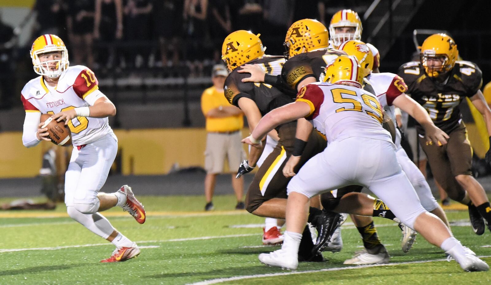 Fenwick quarterback Sully Janeck (10) is under pressure from the Alter defense Sept. 21 at Centerville Stadium. Janeck threw two touchdown passes, but the Falcons lost 45-20. CONTRIBUTED PHOTO BY ANGIE MOHRHAUS