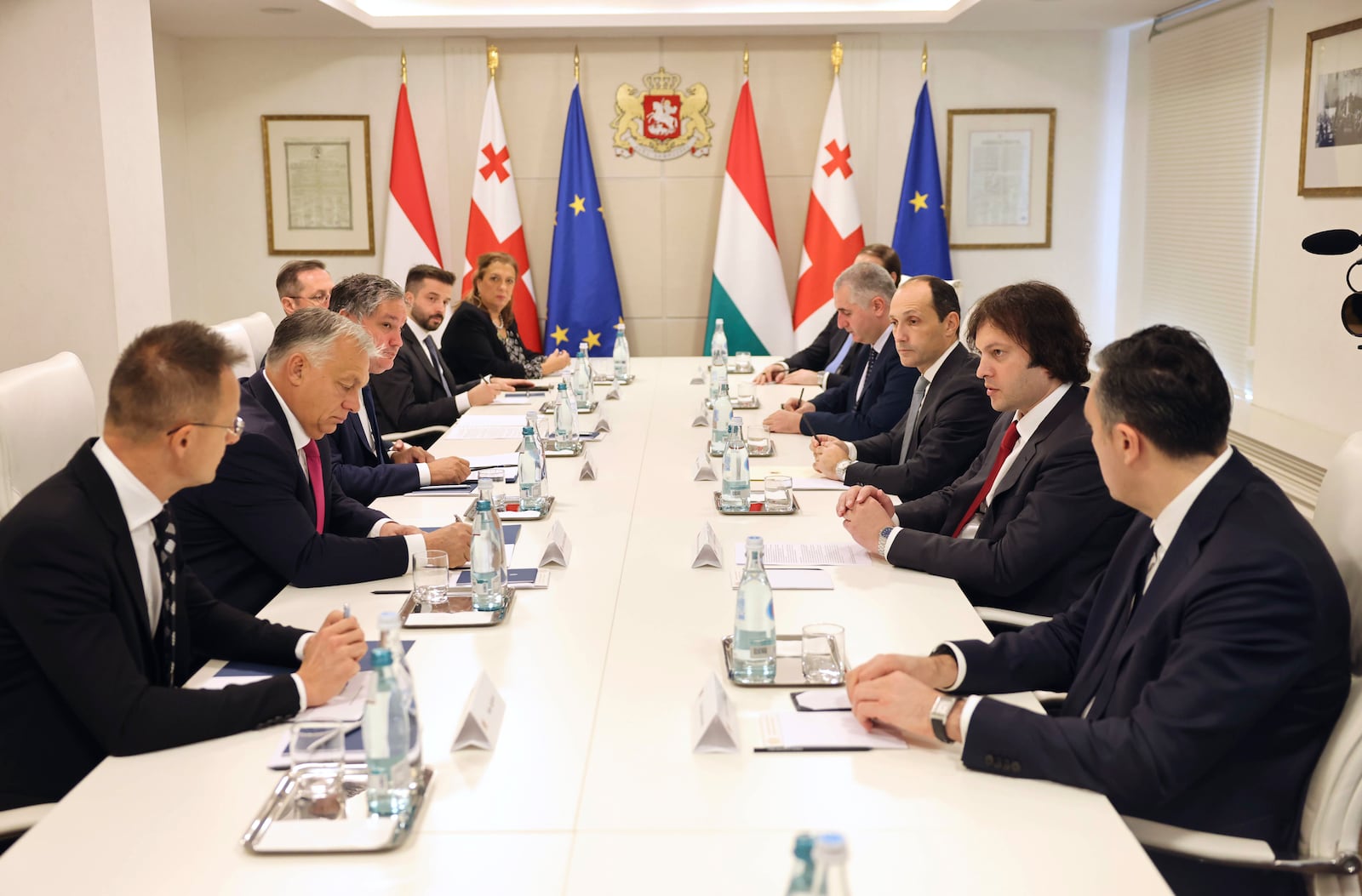 In this photo released by Georgian Prime Minister Press Office on Tuesday, Oct. 29, 2024, Georgian Prime Minister Irakli Kobakhidze, 2nd right, and Prime Minister of Hungary Viktor Orban, 2nd left, speak during their meeting in Tbilisi, Georgia. (Georgian Prime Minister Press Office via AP)