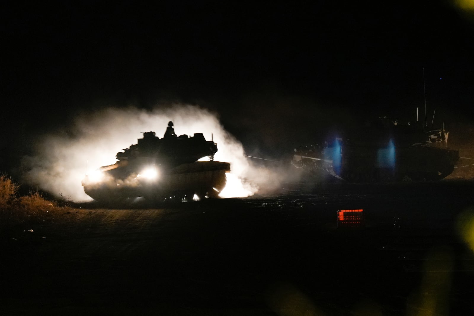 An Israeli tank manoeuvres in northern Israel near the Israel-Lebanon border, Monday, Sept. 30, 2024. (AP Photo/Baz Ratner)