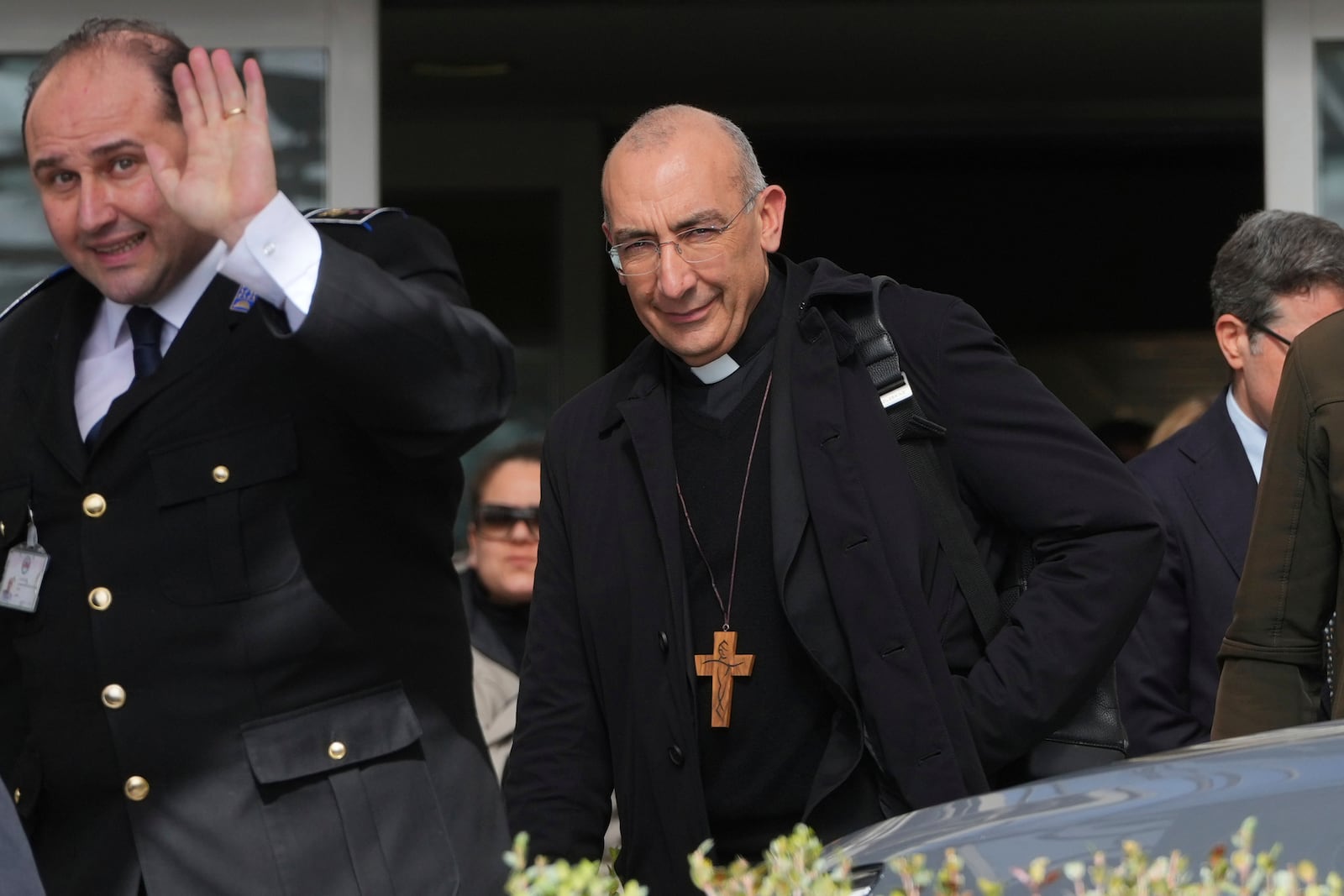 Cardinal Baldassare Reina, right, leaves the Agostino Gemelli Polyclinic, where Pope Francis has been hospitalized since Feb. 14, in Rome, Wednesday, Feb. 26, 2025. (AP Photo/Kirsty Wigglesworth)