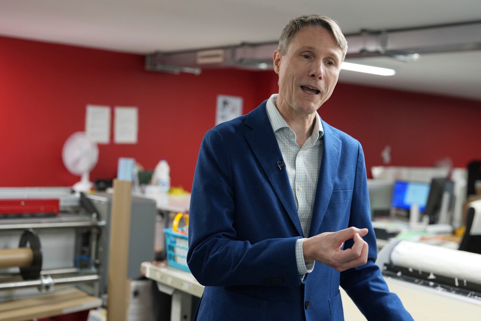 Lars Andersen founder of 'My Nametags' speaks during an interview at his factory in London, Thursday, Jan. 30, 2025. (AP Photo/Alastair Grant)