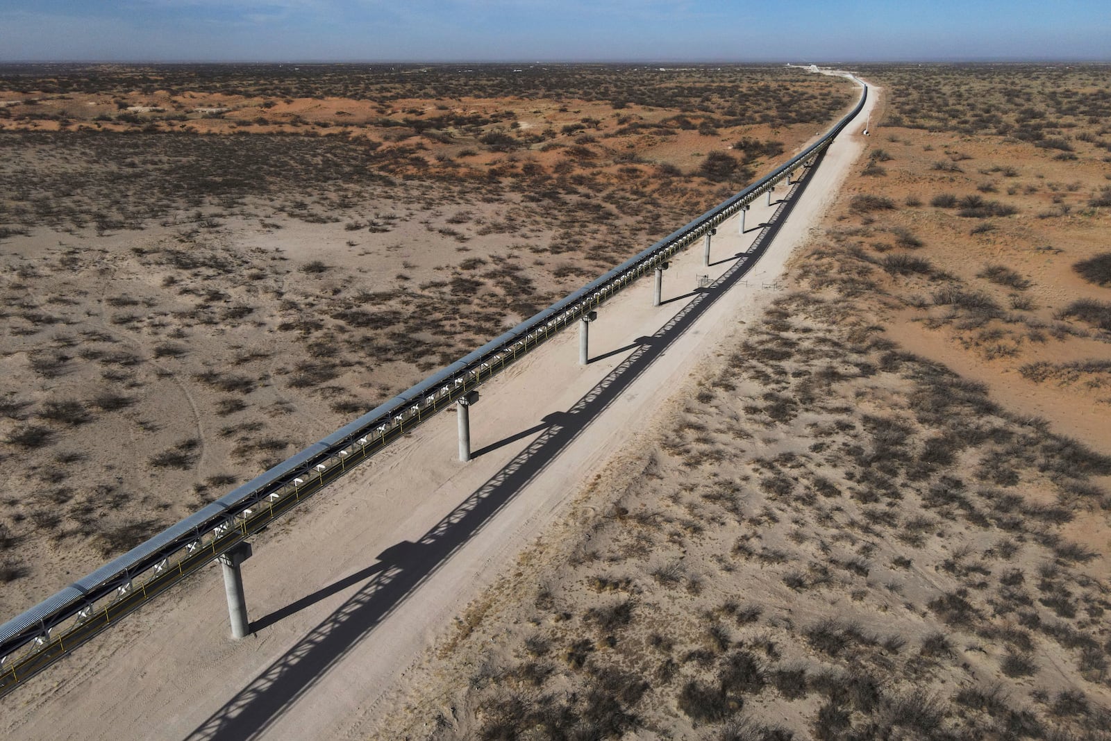 A 42-mile conveyor belt by Atlas Energy carries sand needed for hydraulic fracturing Wednesday, Feb. 26, 2025, in Kermit, Texas. (AP Photo/Julio Cortez)