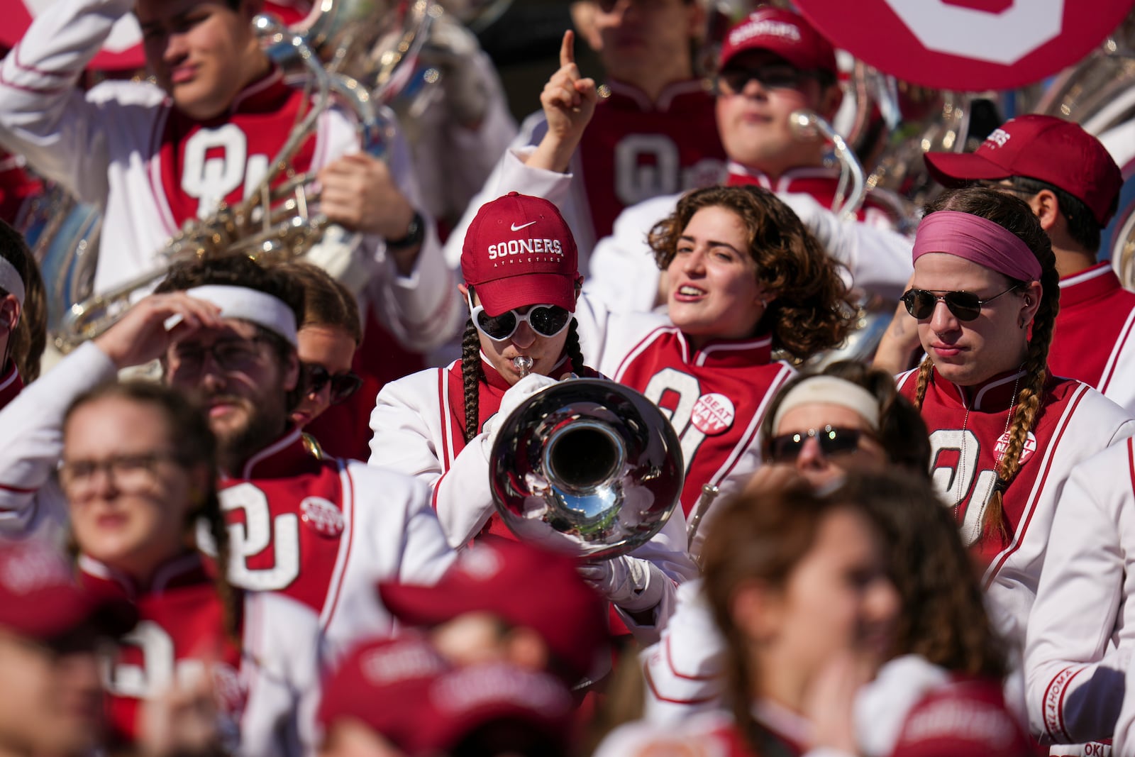 A member of the Oklahoma band tunes an instrument prior to the Armed Forces Bowl NCAA college football game between Navy and Oklahoma, Friday, Dec. 27, 2024, in Fort Worth, Texas. (AP Photo/Julio Cortez)