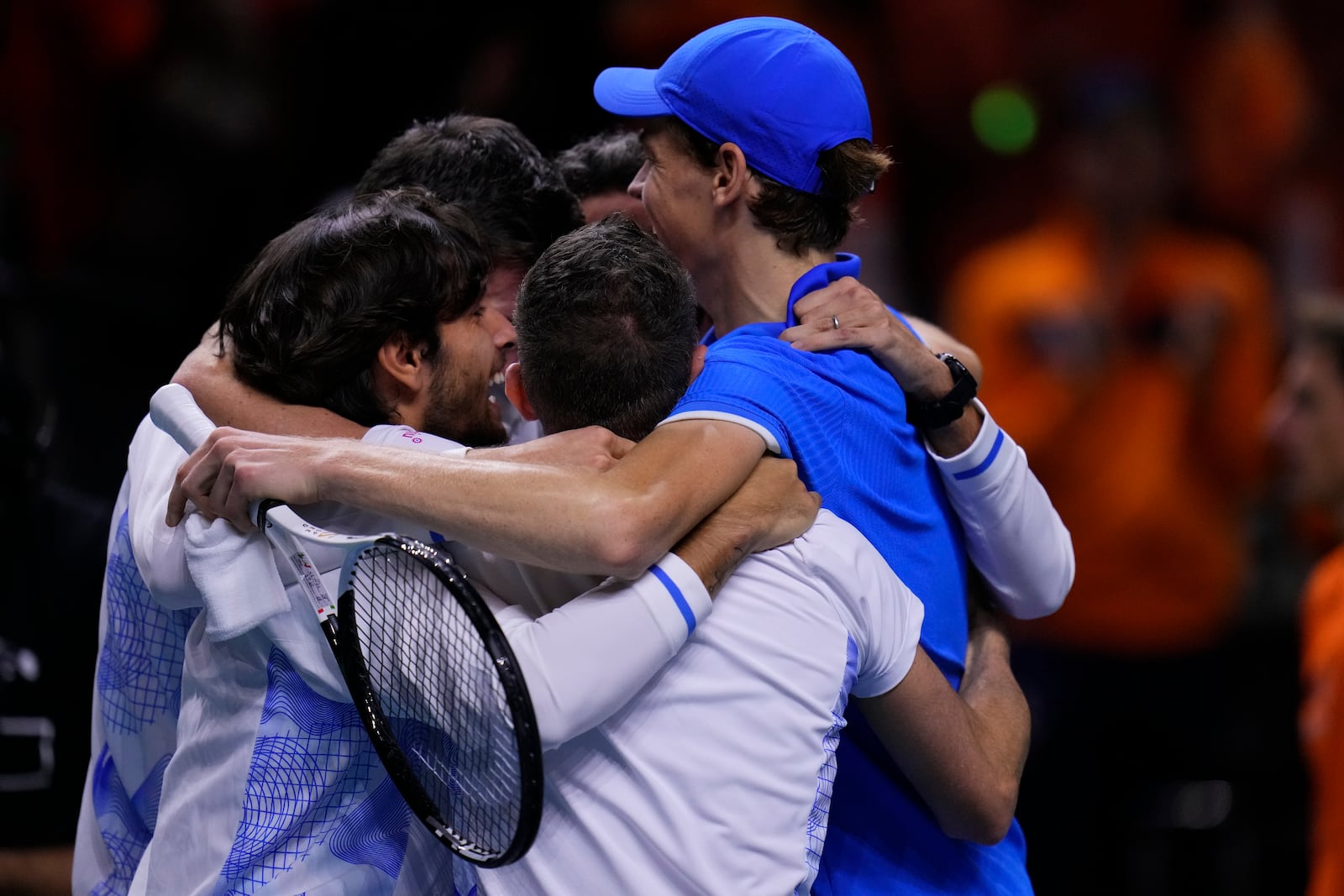 Italy's Jannik Sinner celebrates with teammates after defeating Netherlands' Tallon Griekspoor during the Davis Cup final tennis match between Netherlands and Italy at the Martin Carpena Sports Hall in Malaga, southern Spain, Sunday, Nov. 24, 2024. (AP Photo/Manu Fernandez)