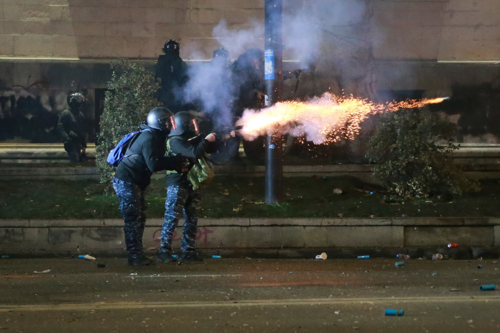 Police officers launch tear gas grenades towards demonstrators protesting against the government's decision to suspend negotiations on joining the European Union in Tbilisi, Georgia, early Tuesday, Dec. 3, 2024. (AP Photo/Zurab Tsertsvadze)