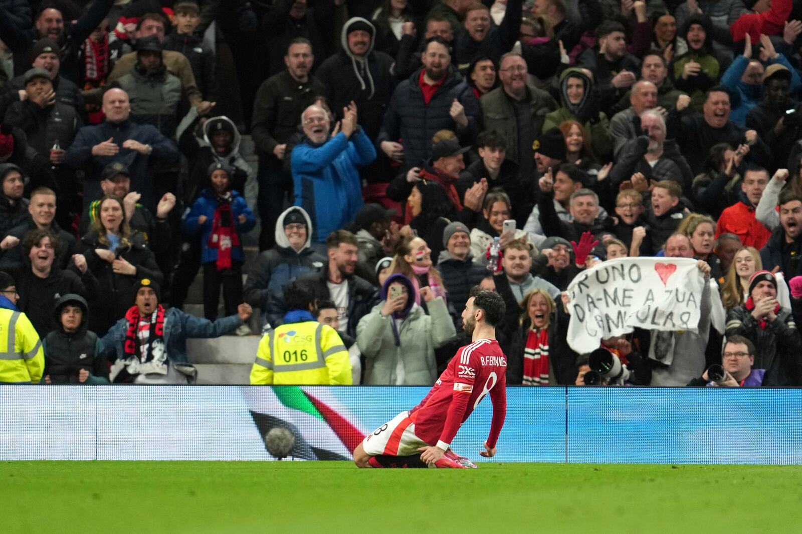 Manchester United's Bruno Fernandes celebrates after scoring his side's opening goal during the English FA Cup soccer match between Manchester United and Fulham at the Old Trafford stadium in Manchester, England, Sunday, March 2, 2025. (AP Photo/Jon Super)