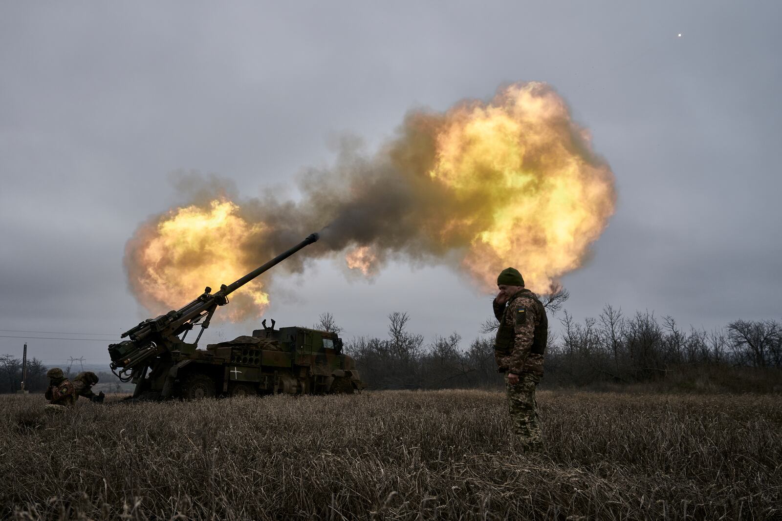 FILE - Ukrainian soldiers fire a French-made CAESAR self-propelled howitzer towards Russian positions near Avdiivka, Donetsk region, Ukraine, on Dec. 26, 2022. (AP Photo/Libkos, File)