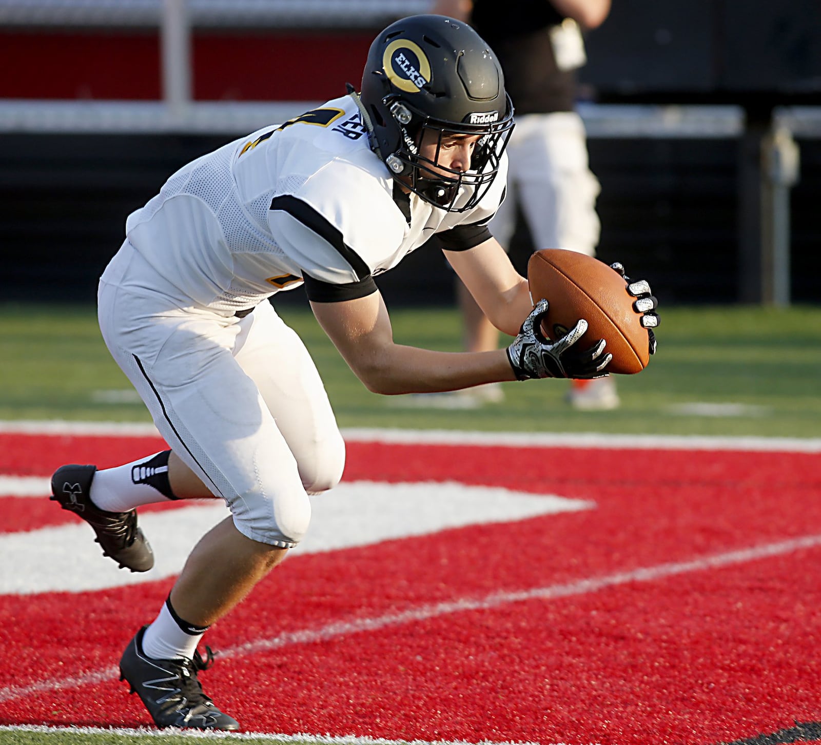 Centerville’s J.R. Melzer makes a touchdown catch Friday night during the Elks’ 30-23 triumph over Fairfield in the Skyline Chili Crosstown Showdown at Fairfield Stadium. CONTRIBUTED PHOTO BY E.L. HUBBARD