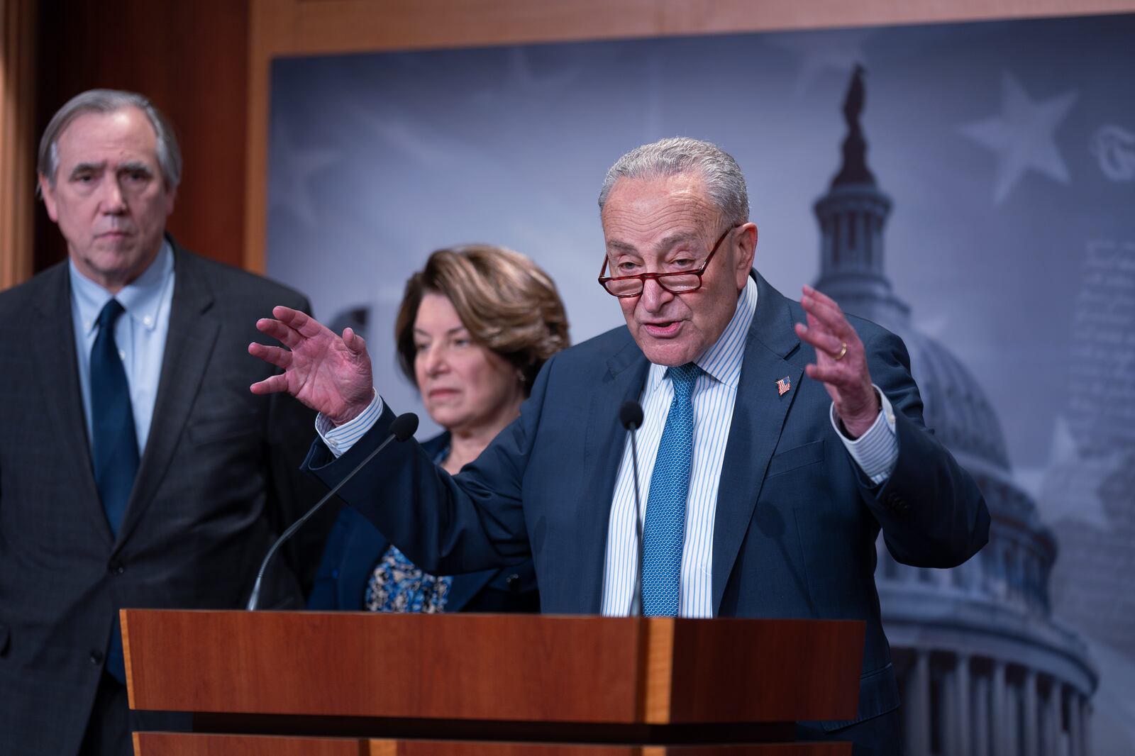 Senate Minority Leader Chuck Schumer, D-N.Y., joined from left by fellow Democrats Sen. Jeff Merkley, D-Ore., and Sen. Amy Klobuchar, D-Minn., slams President Trump's action to freeze federal grants, calling the move illegal and unconstitutional, during a news conference at the Capitol in Washington, Tuesday, Jan. 28, 2025. (AP Photo/J. Scott Applewhite)