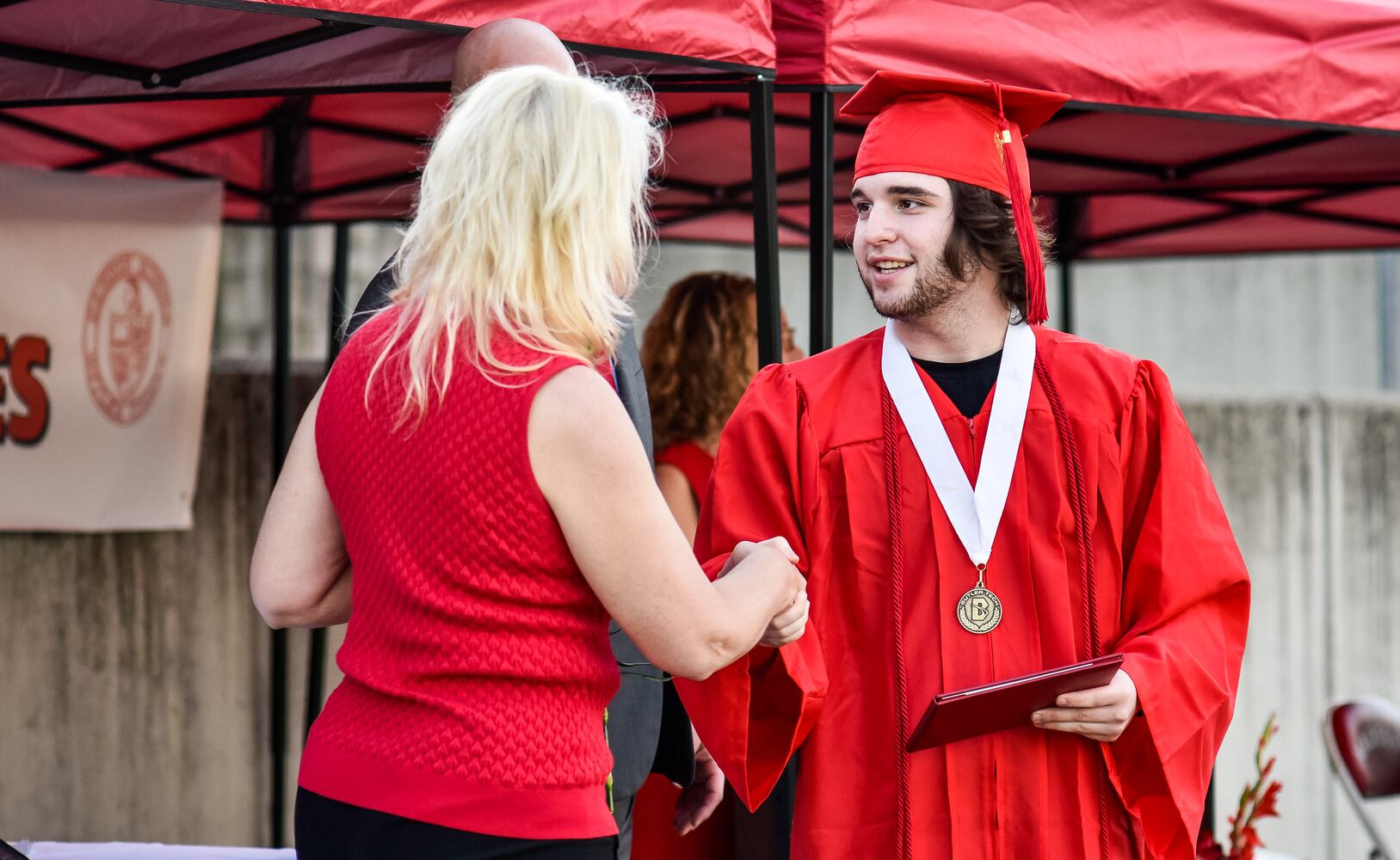 Madison High School drive-thru graduation ceremony at Land of Illusion