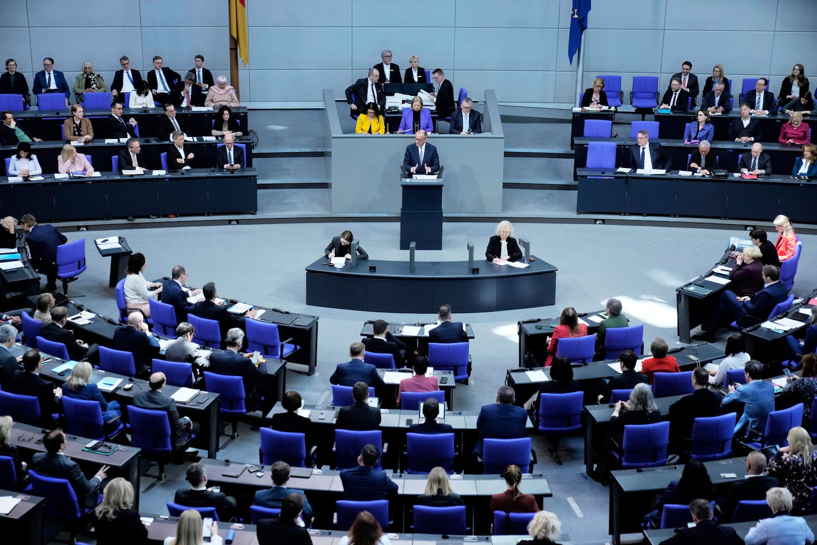 German opposition leader and Christian Democratic Union party chairman Friedrich Merz, right, speaks during a debate and voting about loosen the country's debt rules and change constitution in the German Parliament Bundestag in Berlin, Germany, Tuesday, March 18, 2025. (AP Photo/Ebrahim Noroozi)