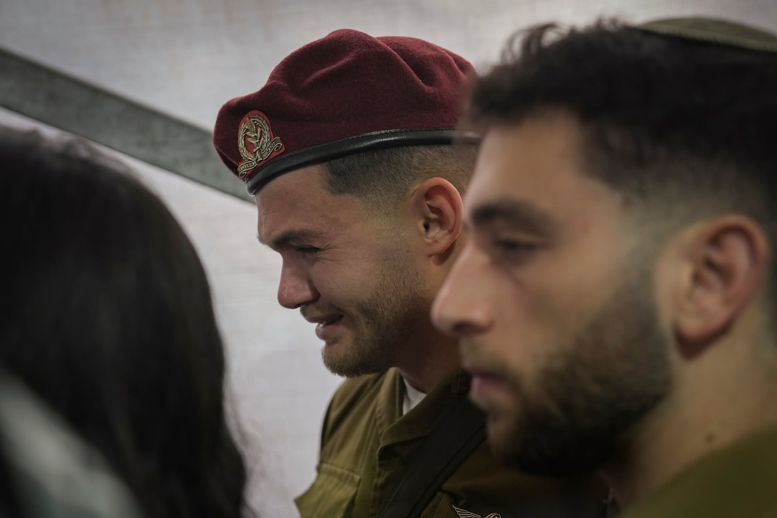 A soldier mourns during the funeral of combat engineer squad commander Staff Sgt. Zamir Burke, 20, from Beit Shemesh, during his funeral at Mount Herzl military cemetery in Jerusalem, Israel, Sunday Nov. 1, 2024. Burke was killed in combat with Hamas at the Jabaliya refugee camp in Gaza. (APcPhoto/Mahmoud Illean)