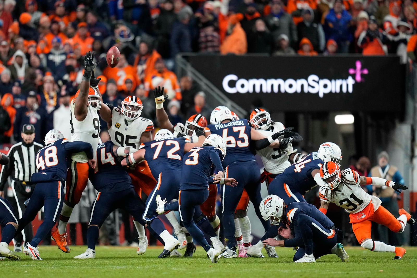 Denver Broncos place-kicker Wil Lutz (3) kicks a field goal during the second half of an NFL football game against the Cleveland Browns, Monday, Dec. 2, 2024, in Denver. (AP Photo/Jack Dempsey)