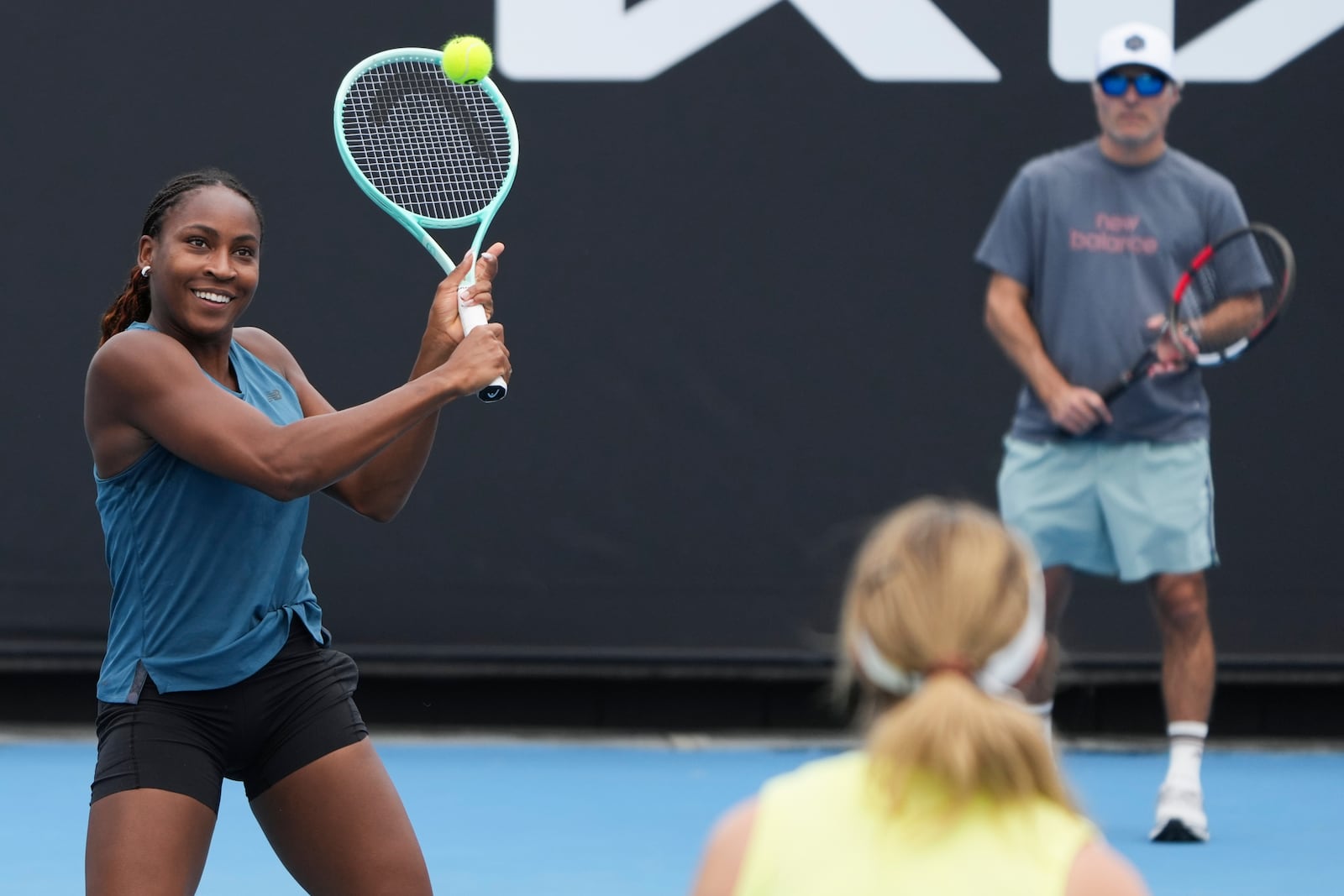 Coco Gauff of the United States plays a backhand return compatriot Danielle Collins during a practice session ahead of the Australian Open tennis championship in Melbourne, Australia, Thursday, Jan. 9, 2025. (AP Photo/Mark Baker)