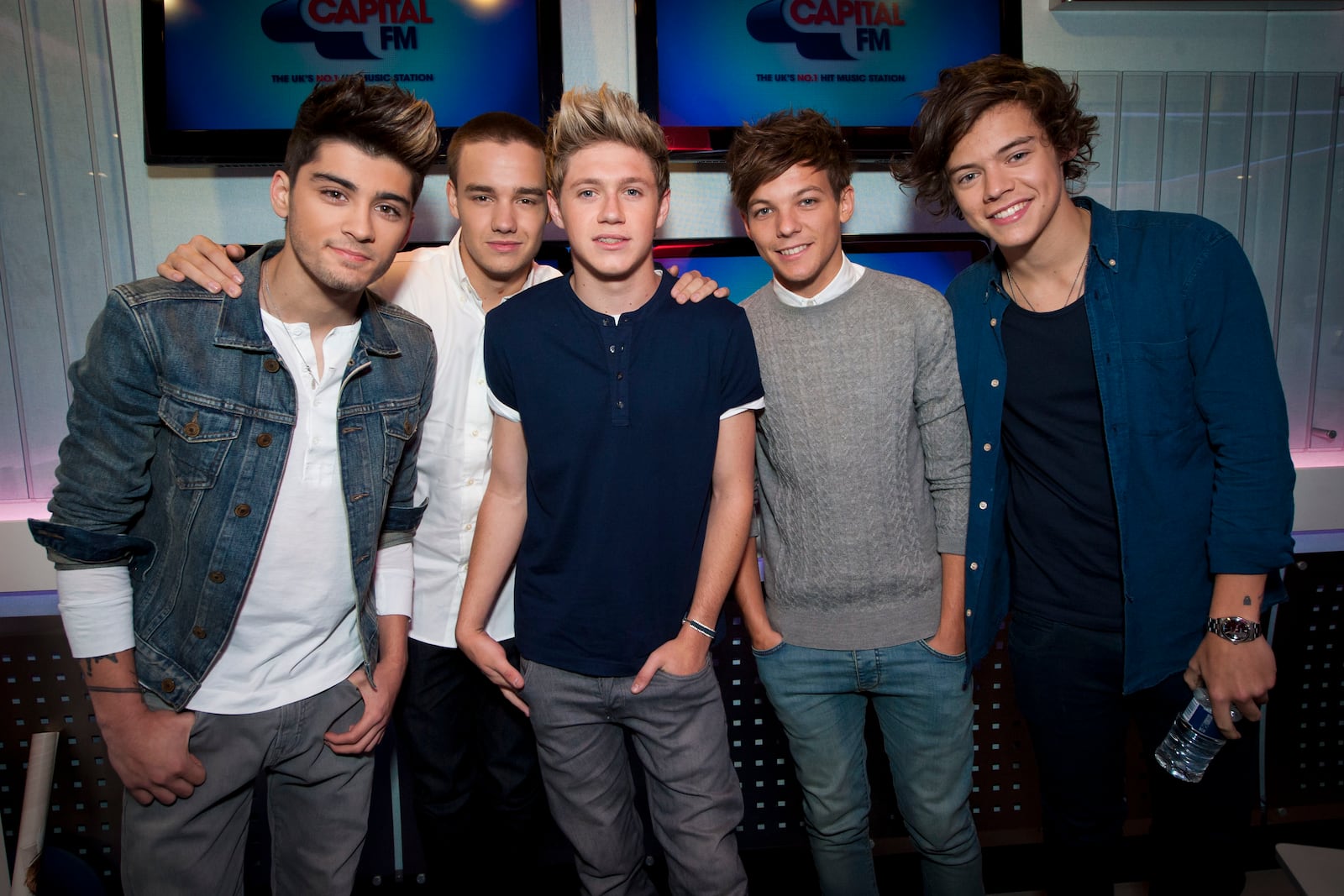 FILE - One Direction's Zayn Malik, from left, Liam Payne, Niall Horan, Louis Tomlinson and Harry Styles pictured during an interview on Capital Breakfast with Dave Berry and Lisa Snowdon, in their studios in Leicester Square, in London, on Friday, Oct. 5, 2012. (Yui Mok/PA via AP, File)