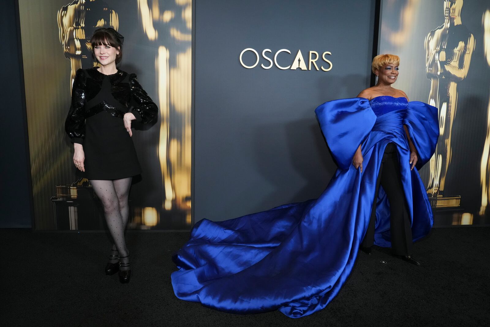 Zooey Deschanel , left, and Aunjanue Ellis-Taylor arrive at the 15th Governors Awards on Sunday, Nov. 17, 2024, at The Ray Dolby Ballroom in Los Angeles. (Photo by Jordan Strauss/Invision/AP)