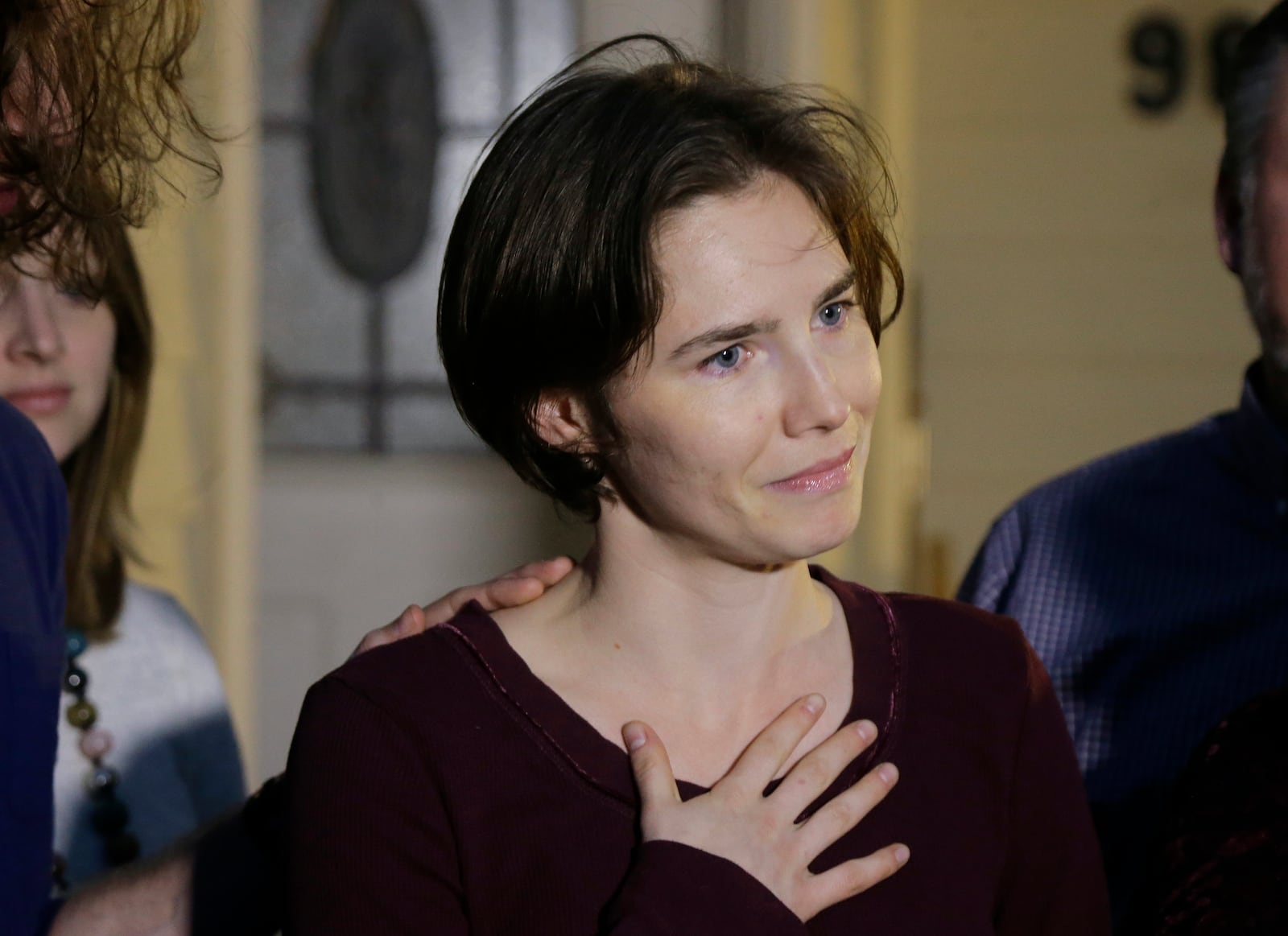 FILE - Amanda Knox talks to reporters outside her mother's home, Friday, March 27, 2015, in Seattle. (AP Photo/Ted S. Warren, File)