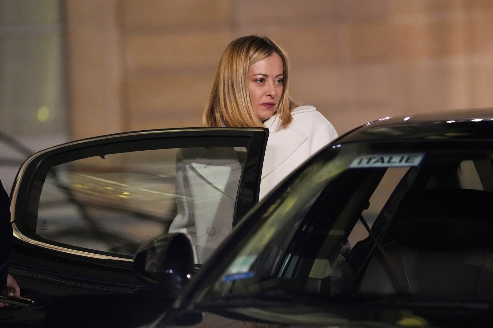 Italy's Prime Minister Giorgia Meloni gets into her car as she leaves the Elysee Palace, after an informal meeting of leaders from key European Union nations and the United Kingdom, in Paris, Monday, Feb. 17, 2025. (AP Photo/Aurelien Morissard)