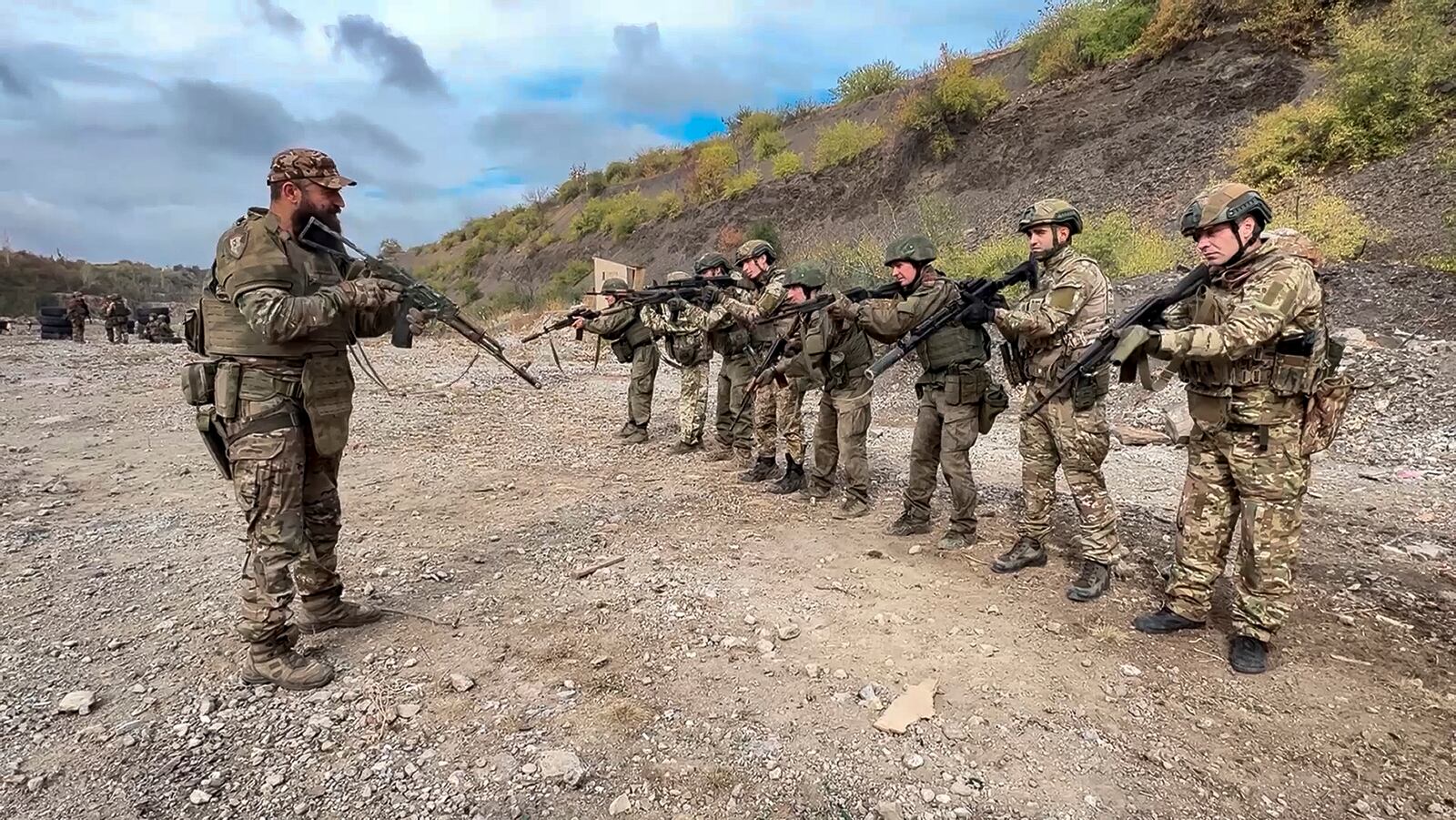 In this image made from video released by the Russian Defense Ministry on Thursday, Oct. 31, 2024, Russian soldiers attend combat training for assault units at an undisclosed location in Ukraine. (Russian Defense Ministry Press Service via AP)