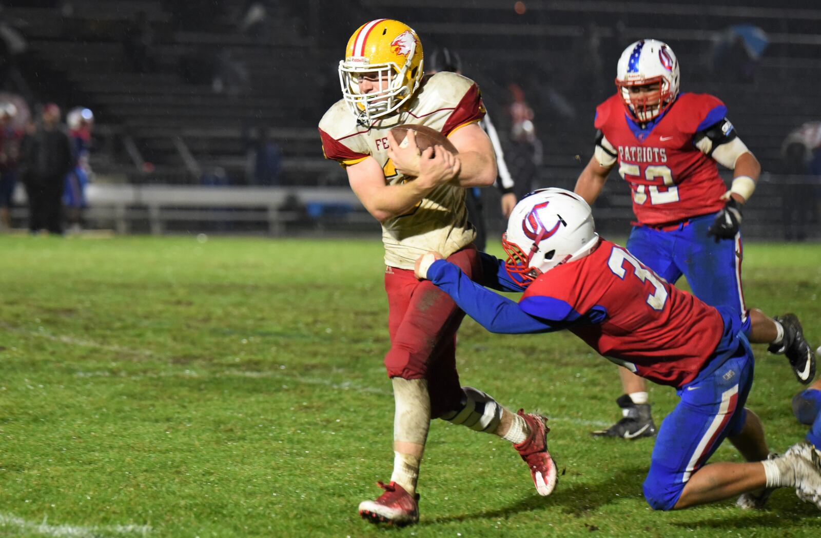 Fenwick’s Jack Fessler breaks a tackle en route to a touchdown during Friday night’s 42-41 triumph over host Carroll in Riverside. CONTRIBUTED PHOTO BY ANGIE MOHRHAUS