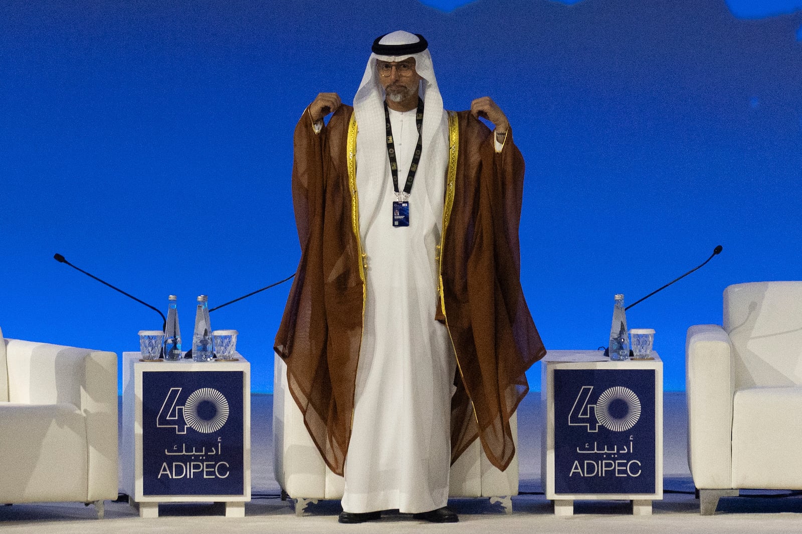 UAE Minister of Energy and Infrastructure Suhail al-Mazrouei arrives on the stage to participate in a panel discussion during the the inaugural session of annual Abu Dhabi International Petroleum Exhibition and Conference (ADIPEC) in Abu Dhabi, United Arab Emirates, Monday, Nov. 4, 2024. (AP Photo/Altaf Qadri)