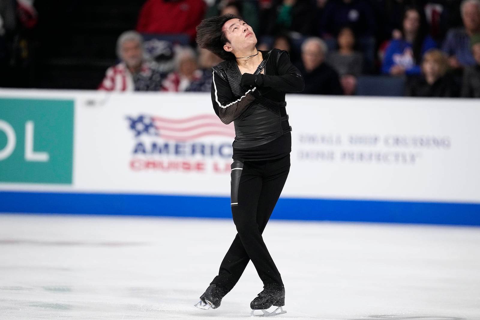 Kao Miura of Japan competes during the men's short program at the Skate America figure skating event in Allen, Texas, Saturday, Oct. 19, 2024. (AP Photo/Tony Gutierrez)