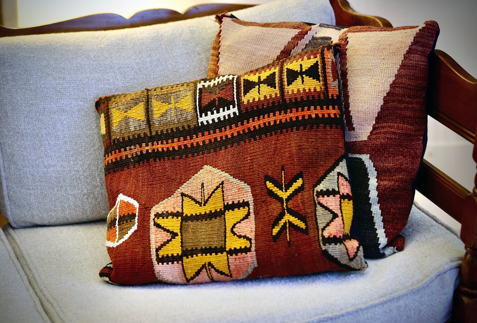 Chris Saunders enjoys bringing back treasures from her travels. These pillows are from India. MARSHALL GORBY\STAFF