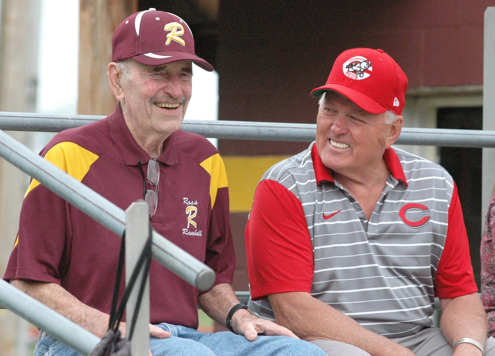 Former Ross High School coaches Bob Walton (left) and Gary Weitzel share a laugh Wednesday before a ceremony honoring the Rams’ 2009 Division II state championship softball team at RHS. RICK CASSANO/STAFF