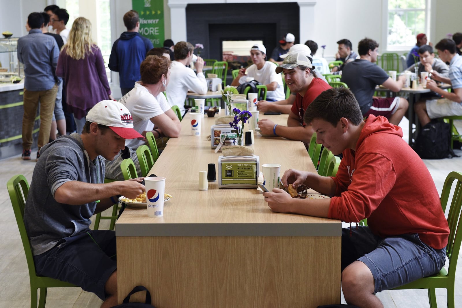 Miami University students eat in the new Garden Commons dining hall on campus Thursday, Aug. 27. The university’s new EnviroPure machine breaks down waste from its dining halls, turning it into treatable water, thereby reducing the amount of trash sent to landfills. NICK GRAHAM/STAFF