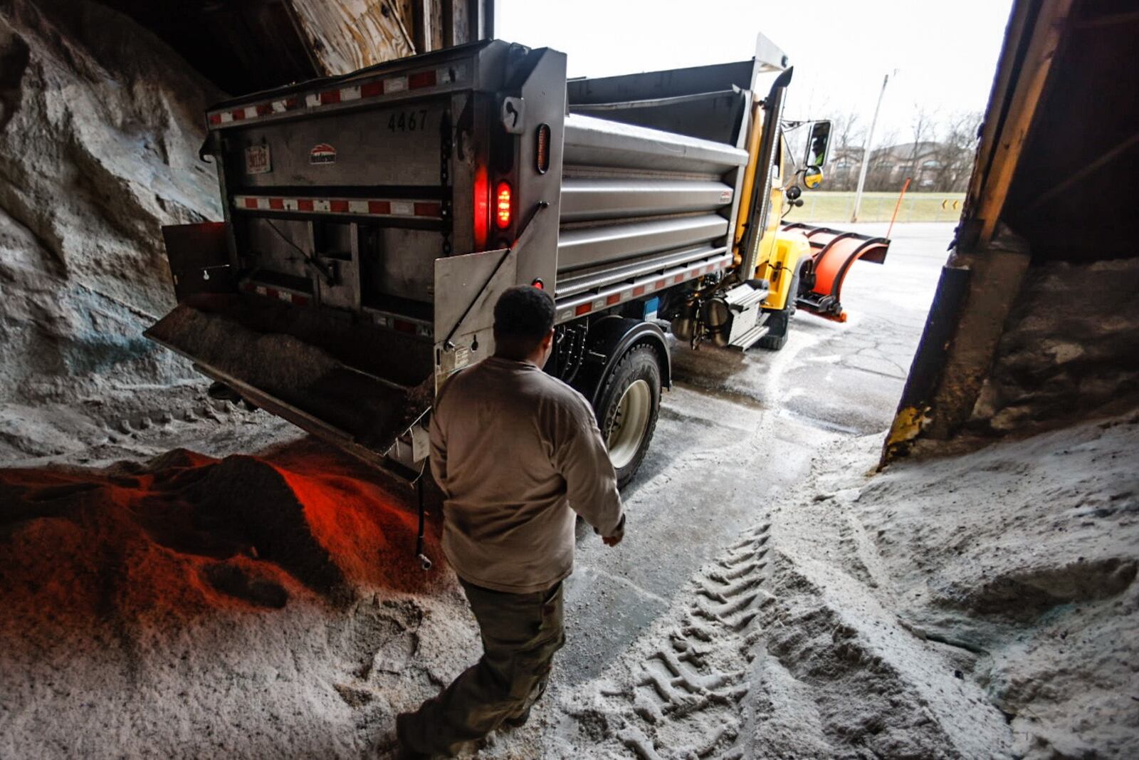 Crews at Montgomery County Engineers building on Little Richmond Road load trucks Thursday December 22, 2022 with salt in preparation of a winter storm that is approaching the Miami Valley. Jim Noelker/Staff