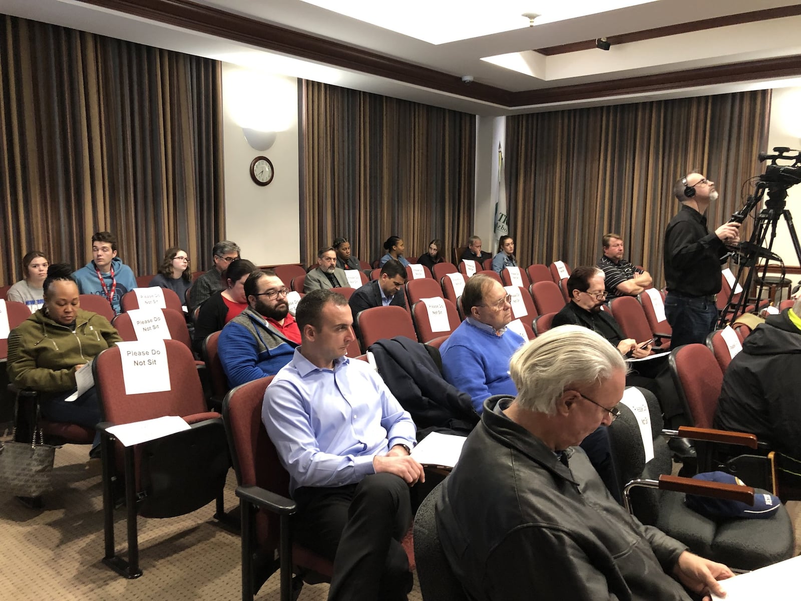 As a precaution, every other seat at Hamilton City Council’s Wednesday meeting was marked as a place people should not sit, as a precaution against the spread of coronavirus. MIKE RUTLEDGE/STAFF