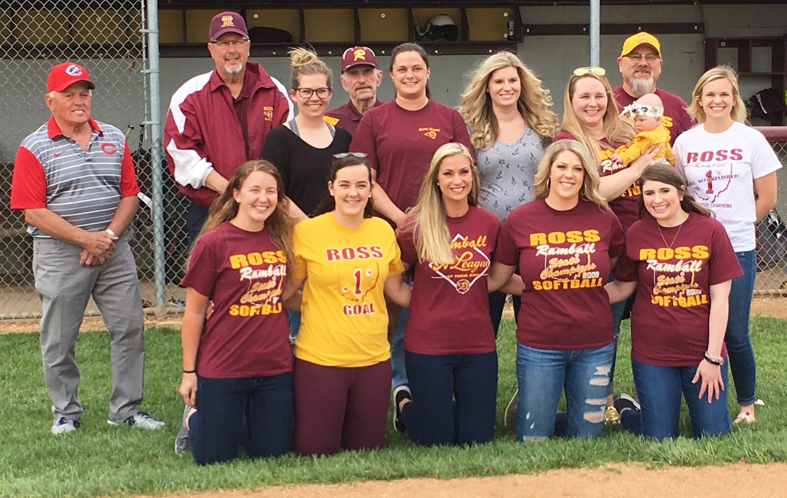 Members of Ross High School’s 2009 Division II state championship softball team pose for a photo before Wednesday’s game against visiting Northwest. RICK CASSANO/STAFF