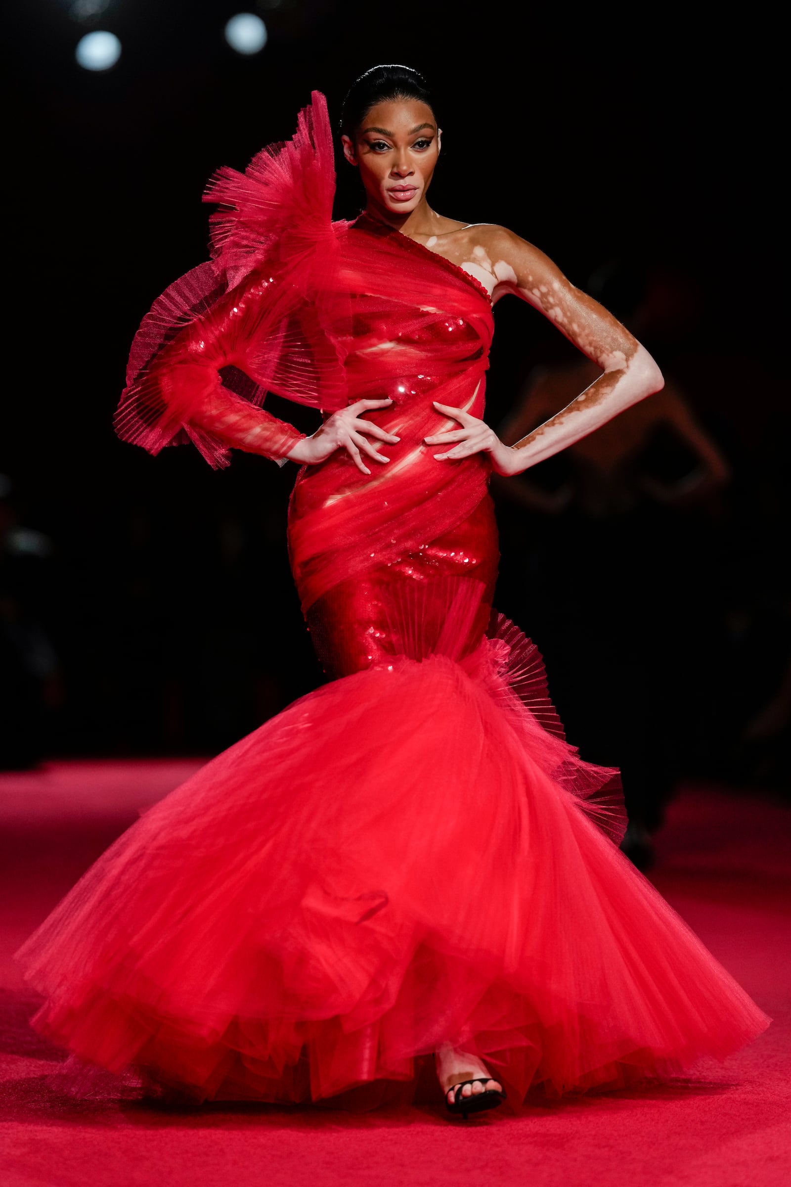 Winnie Harlow walks the runway during the Christian Siriano Fall/Winter 2025 fashion show at Chelsea Industrial during New York Fashion Week on Thursday, Feb. 6, 2025, in New York. (Photo by Charles Sykes/Invision/AP)