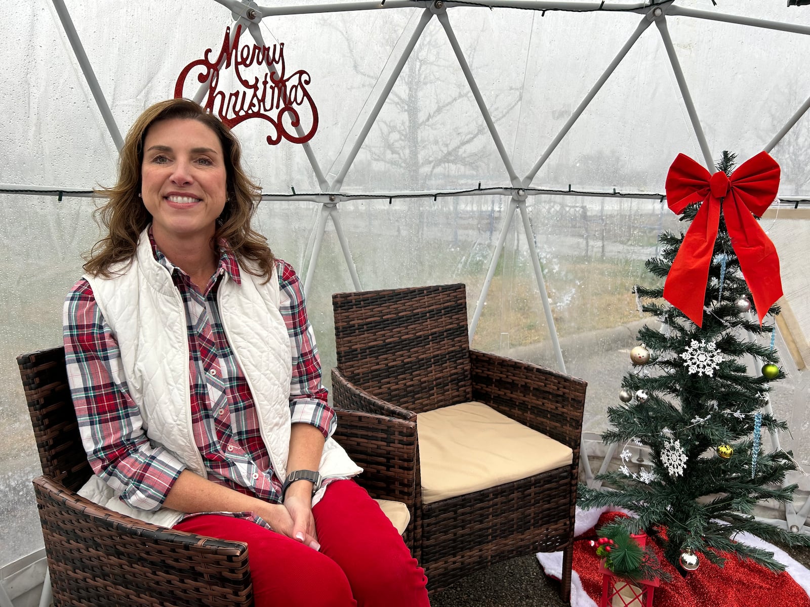 Avinne Kiser, founder of Holiday Whopla in Middletown, recently received two major awards. She sits in a heated igloo near the ice skating rink. RICK McCRABB/CONTRIBUTOR