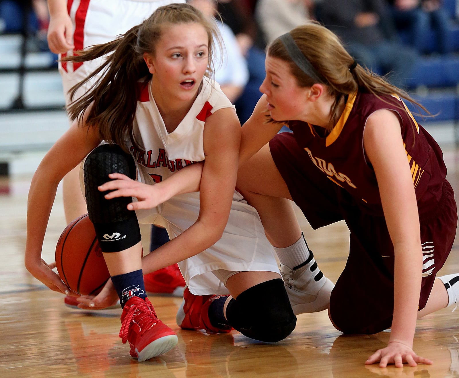 Talawanda guard Addie Brown (left) tries to keep a loose ball away from Karlie Becker of Ross during their game at Talawanda on Feb. 6, 2016. COX MEDIA FILE PHOTO