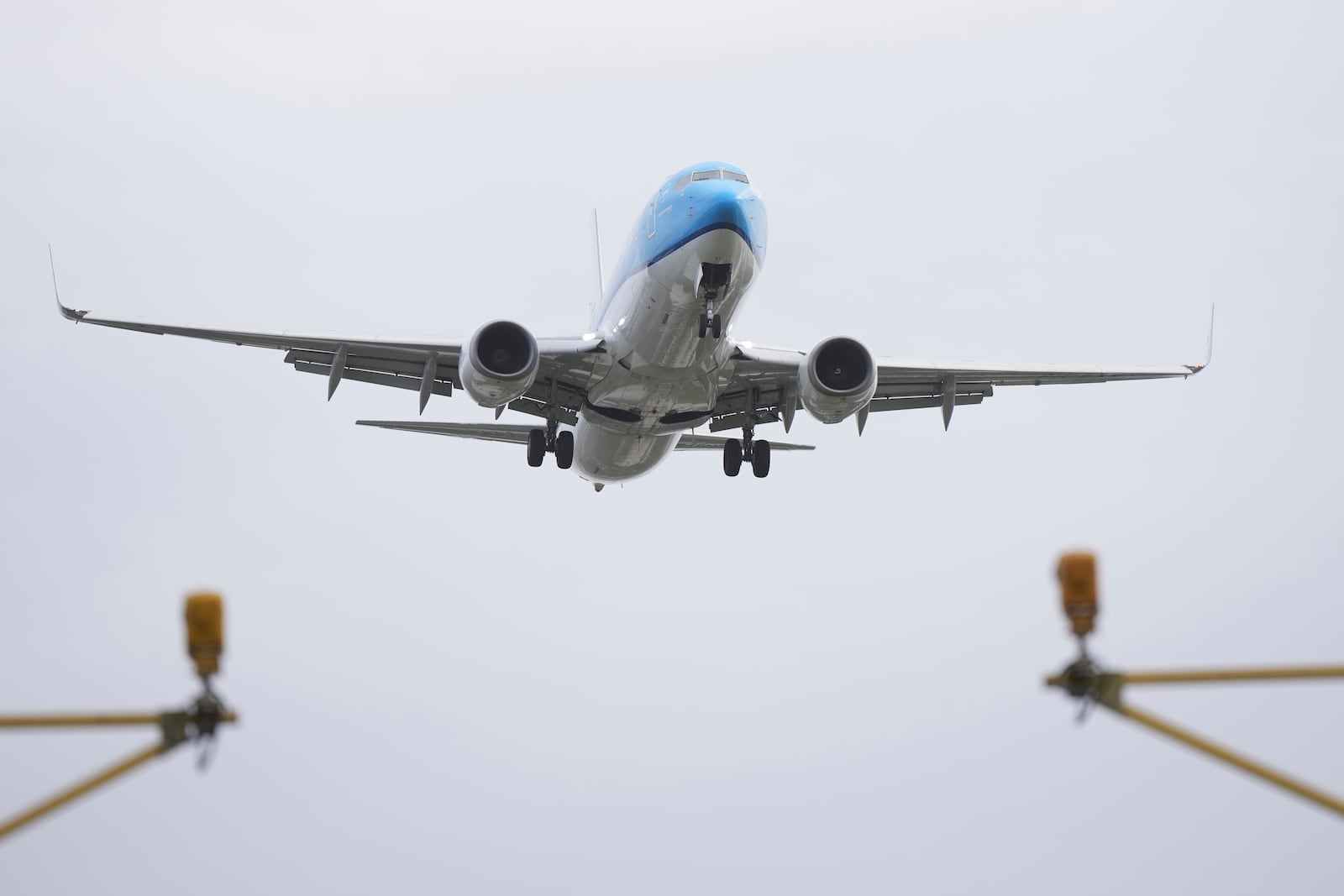 An aeroplane lands in gusty conditions at Heathrow Airport in London, Friday, Jan. 24, 2025, as storm Eowyn disrupts travel the British Isles. (AP Photo/Alastair Grant)