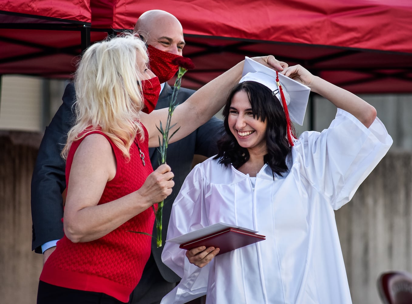 Madison High School drive-thru graduation ceremony at Land of Illusion