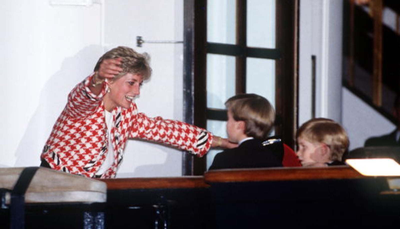 The Princess of Wales greets her sons Prince William and Prince Harry on the deck of the yacht Britannia in Toronto, when they joined their parents on an official visit to Canada, 23rd October 1991. The Princess is wearing a Moschino suit.   (Photo by Jayne Fincher/Princess Diana Archive/Getty Images)